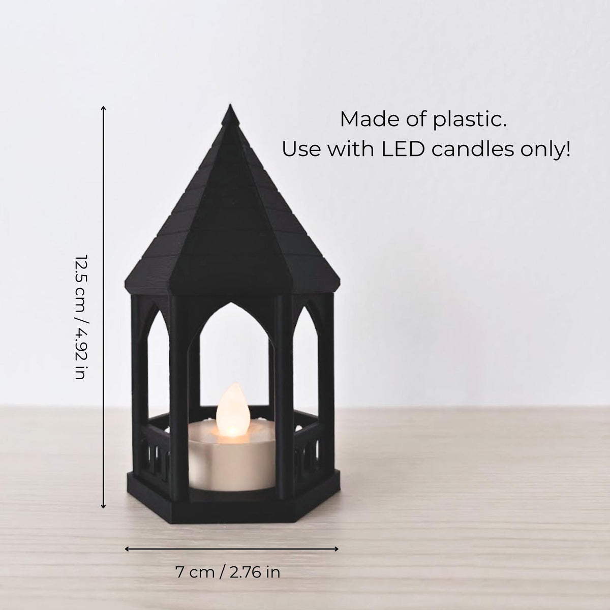 Dimensions Graphic: A sizing guide showing the black gazebo tealight holder with text indicating it is 12.5 cm (4.92 inches) tall and 7 cm (2.76 inches) wide. Additional text reads "Made of plastic. Use with LED candles only!".