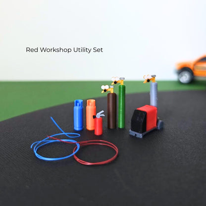 Red workshop utility set with gas cylinders, welding machine, fire extinguisher and coiled red and blue hoses.