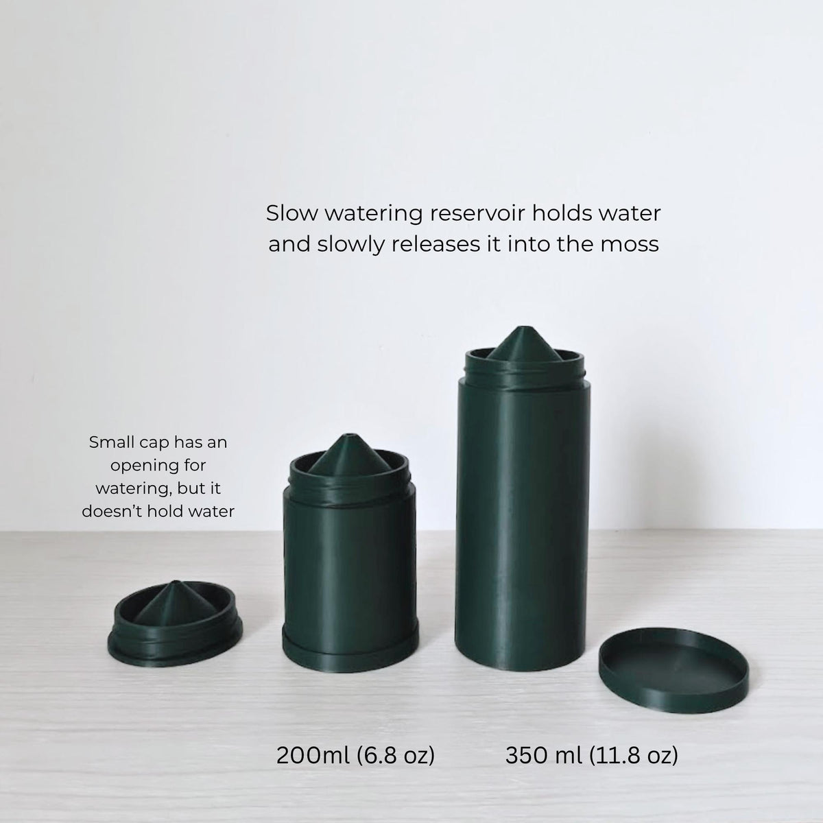 Close-up of watering cap and reservoir for plant hydration. The small cap has an opening. The slow watering reservoir holds up to 200ml or 350 ml of water and slowly releases it into the moss. One reservoir holds 200ml, the other holds 350 ml.