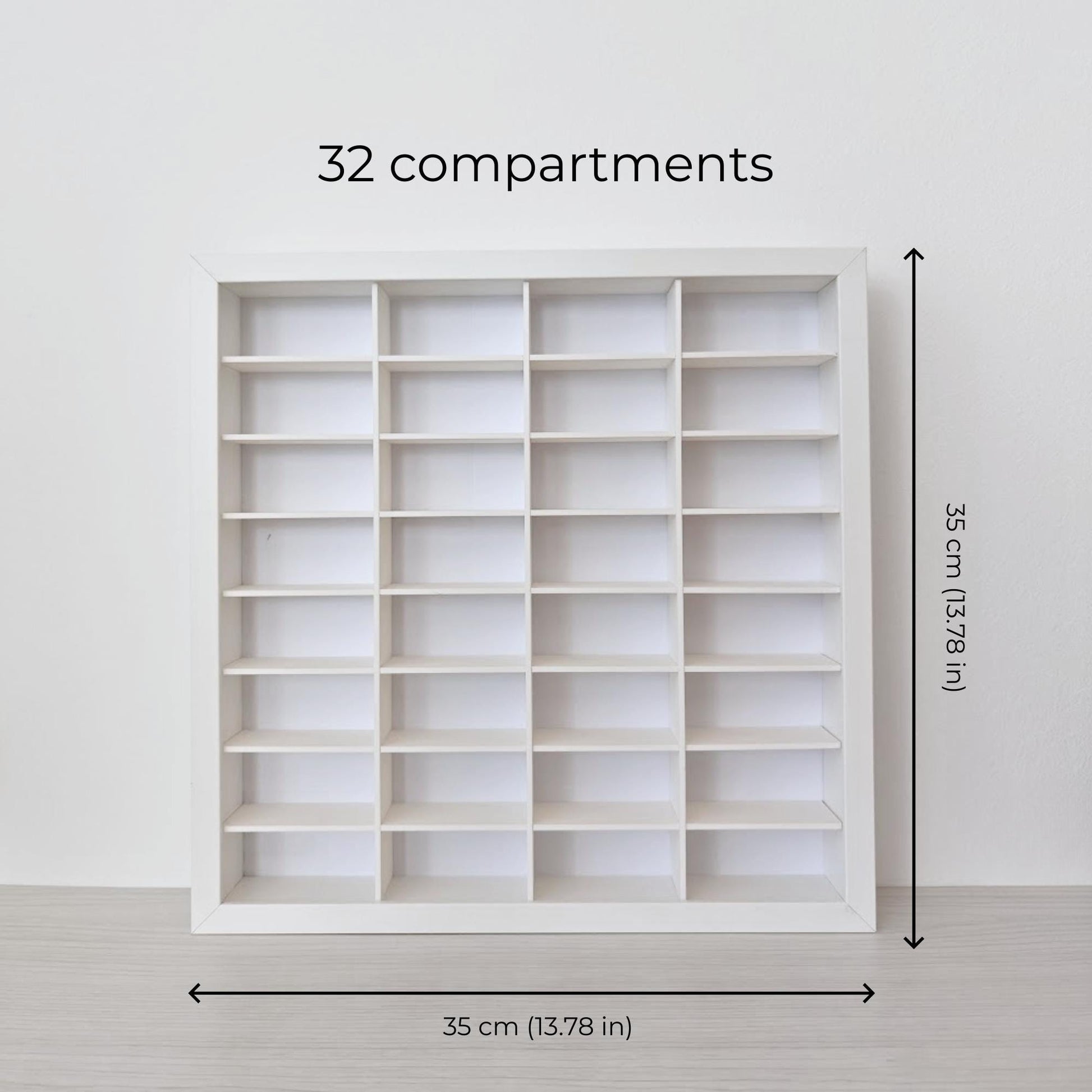 Empty white 32-compartment display grid inside a SANNAHED frame, with arrows showing the overall size of 35 × 35 cm (13.78 × 13.78 in).