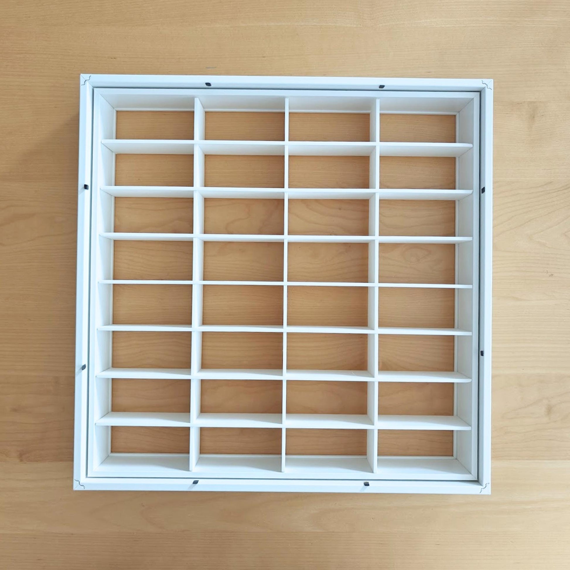 Top-down view of the assembled grid insert fitted inside the separate inner section of the SANNAHED frame.