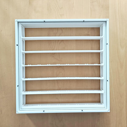 Assembled white display grid fitted inside the removable inner section of the SANNAHED frame.