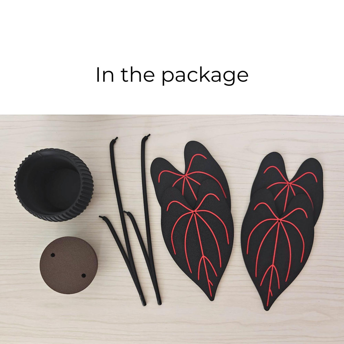 Anthurium Queen of Hearts coaster set package contents including four leaf coasters, stems, pot and removable base.