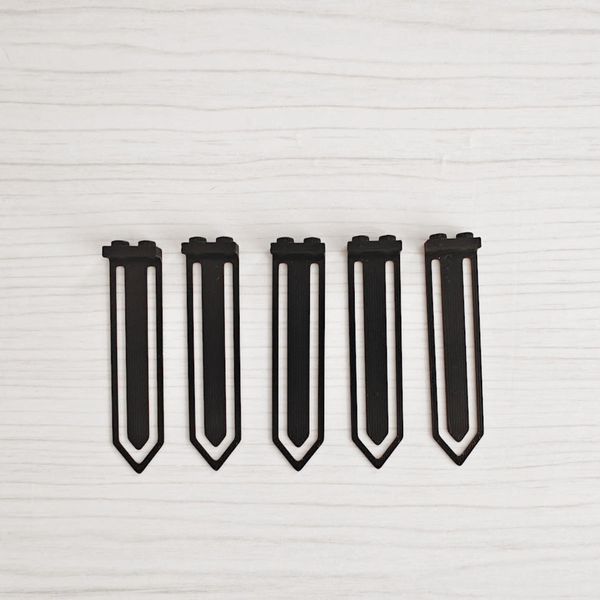 Set of five black brick-compatible bookmark clips