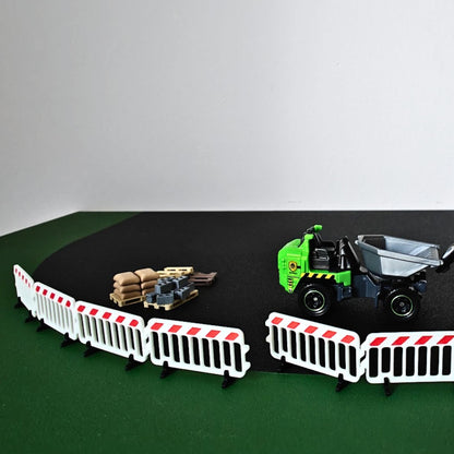 1:64 construction diorama with barricades, pallets and dump truck
