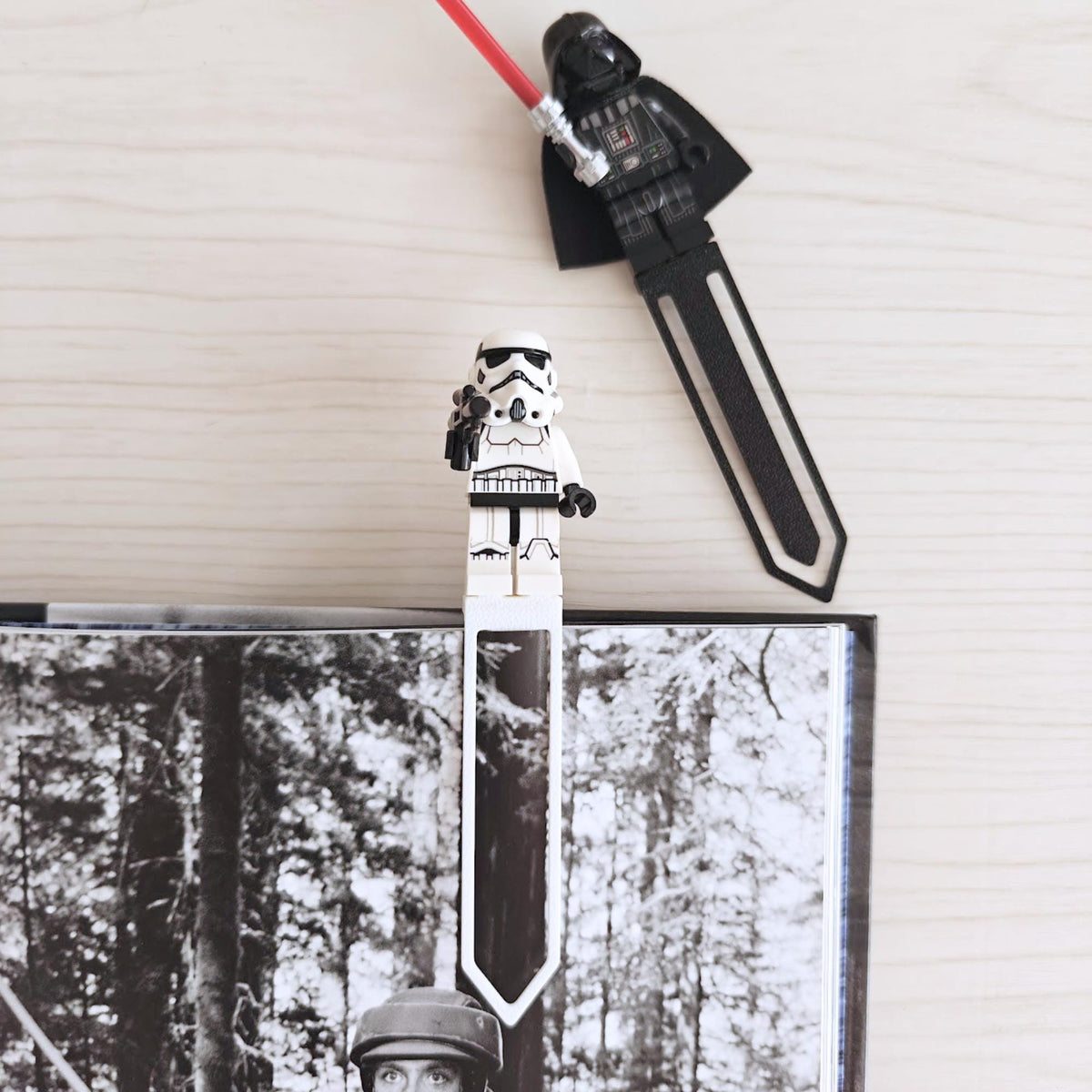 Black minifigure bookmark clips used as page markers in books