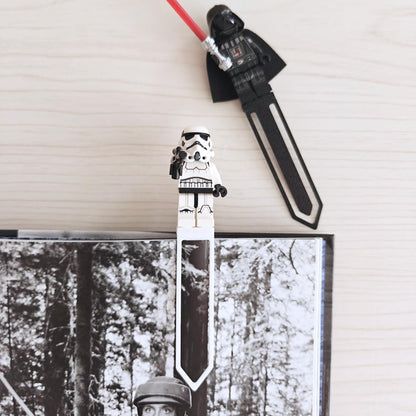 Black minifigure bookmark clips used as page markers in books
