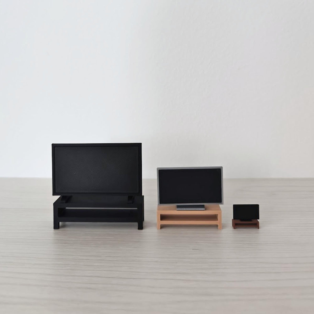 Miniature TV display set in 1:18, 1:24 and 1:64 scales with matching TV stands.