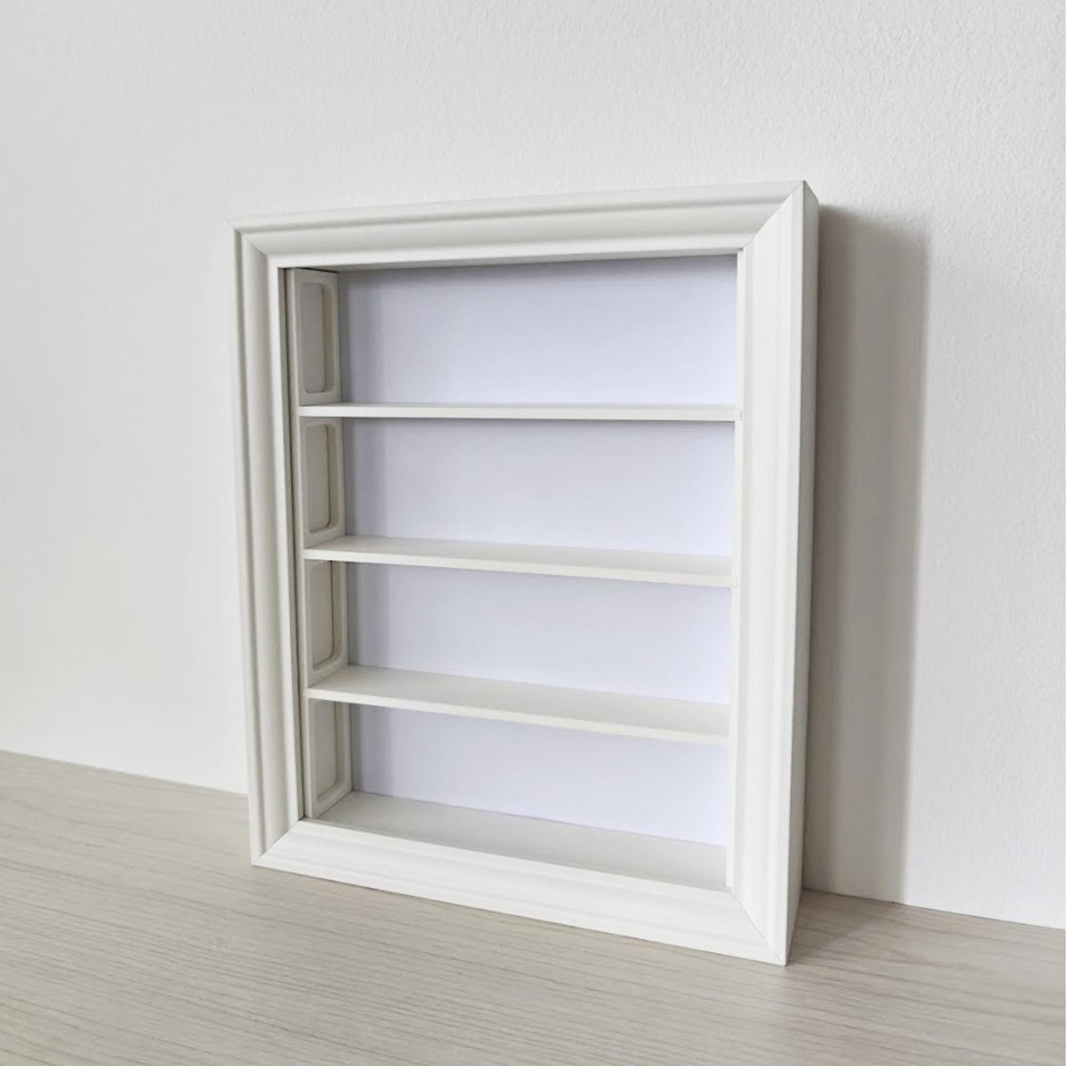 Angled view of empty vertical IKEA VÄSTANHED frame with white 3D printed shelf insert.